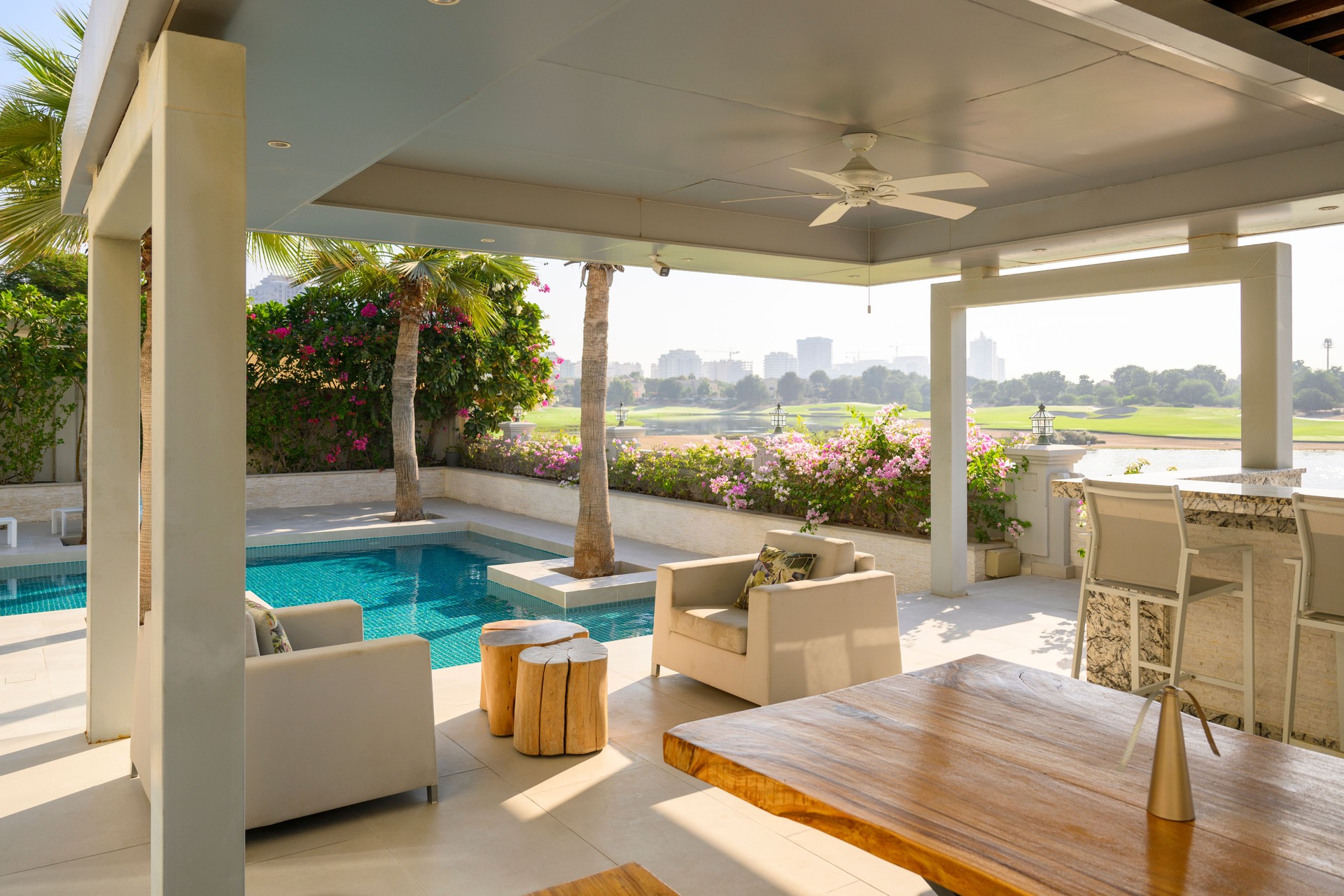 Luxury shaded terrace area with swimming pool